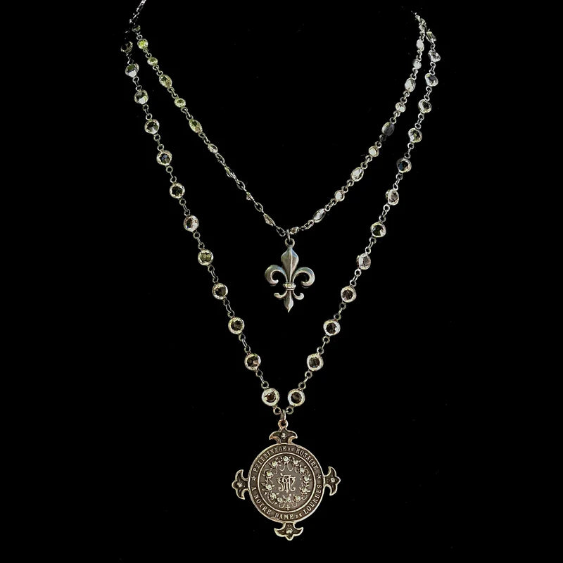 The Majestic Mary Magdalene at la Sainte-Baume in Amethyst Necklace with the Lourdes Illumination Necklace