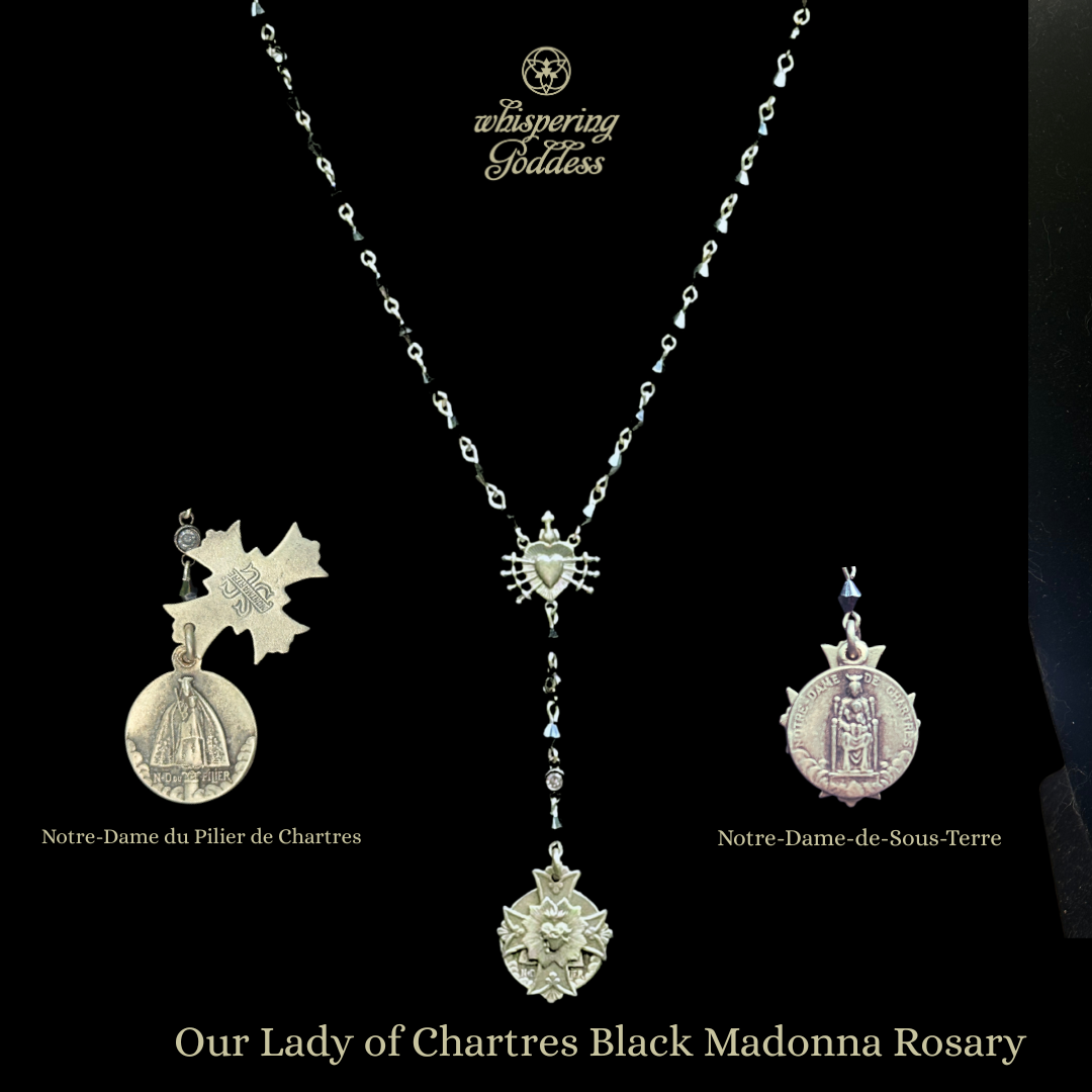 Silver rosary set with medals on a black background, featuring the Black Madonnas of Chartres