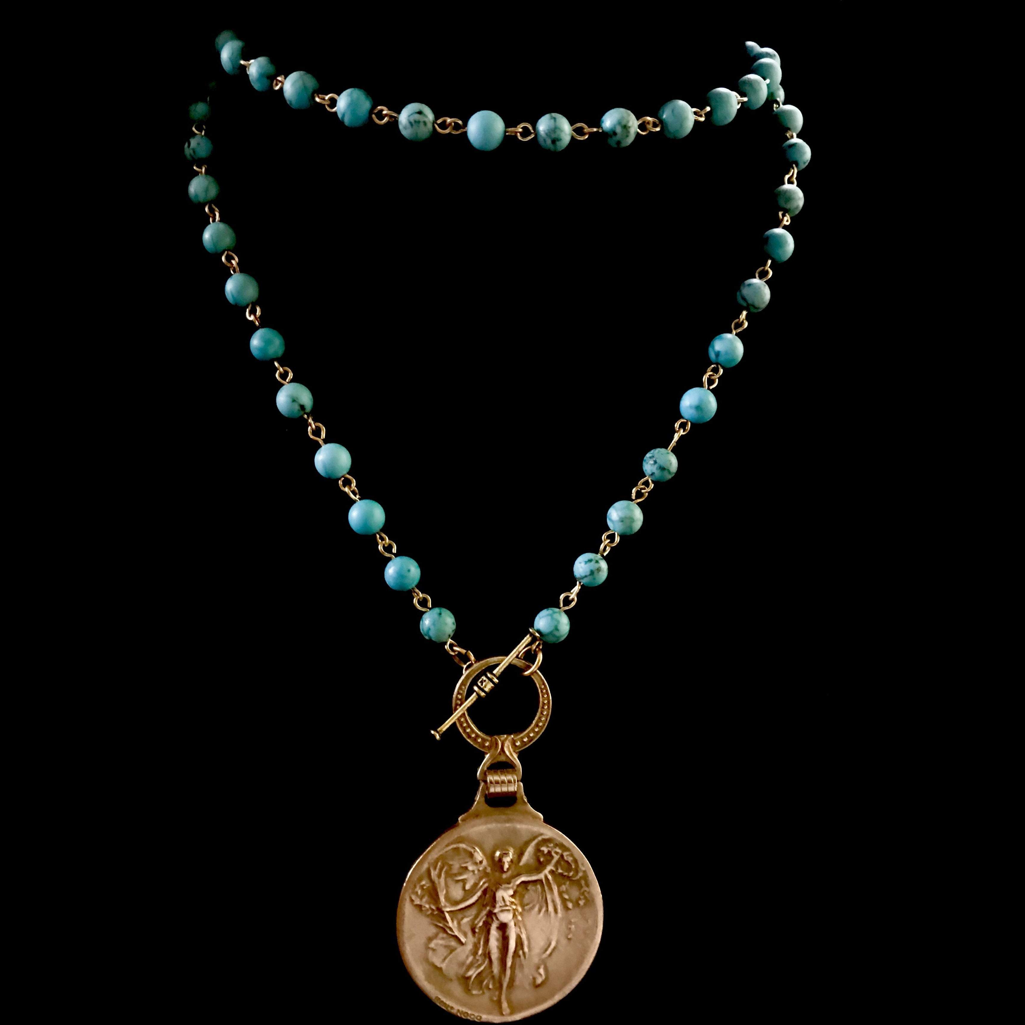 Nike Crowning Coin Pendant